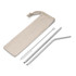 A set of reusable steel straws in silver, accompanied by a cleaning brush and a natural cotton carry pouch.