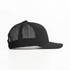 A black trucker cap with a mesh back and a curved peak, featuring a logo on the front.