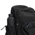 A black Mono Backpack featuring a drink bottle in the side pocket and a phone visible in the front compartment.