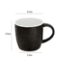 A black coffee mug with a white interior, featuring a handle and measurements indicated. It has a logo.