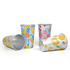 Colourful cups with fruit patterns, featuring designs in yellow, blue, and pink, with silver insides and a logo.