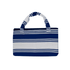 A foldable beach towel bag in navy blue and white stripes, featuring two handles and a branding logo.