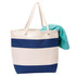 A striped cotton canvas tote bag in cream and navy blue, featuring twisted rope handles and a turquoise towel.