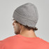 A grey ribbed beanie displayed on a model's head, featuring a logo on the side.