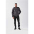 A men's quilted thermal jacket in black is worn by a model, featuring a front zip and a casual fit.