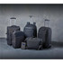 A collection of black bags, including backpacks, a wheeled suitcase, and a messenger bag, with a sleek design.
