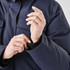 A navy Women's Denali Parka being worn, highlighting the cuffs and detailing of the puffer jacket.