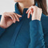 A women's thermal 1/4 zip pullover in deep teal, featuring a textured fabric and a zippered collar.