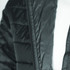 A black women's puffer jacket featuring a zip and quilted design, with a logo on the fabric.