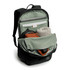 A black daypack with a green interior, featuring compartments for a laptop, a towel, and a small pouch.