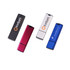 A set of four flash drives in black, pink, silver, and blue, each with a logo or branding.