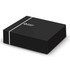 A black box with a sleek design, featuring a logo on the top and a minimalist white stripe.