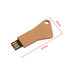 A rectangular eco-friendly flash drive in natural brown tone with a key-shaped design and a black USB connector.