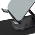 A black metal phone and tablet stand with adjustable angles and a sturdy base. The surface is smooth and reflective.