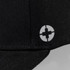 A black cap featuring a circular logo on the side. It has a six-panel design.