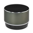 A round Bluetooth speaker in matte grey with a black speaker grill and a silver trim, featuring a branding logo.