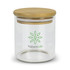 A small round glass storage canister with a bamboo lid and a green logo on the front.