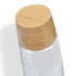 A drink bottle featuring a clear glass body and a bamboo lid, designed for practical use.