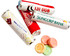 A selection of colourful round lollies beside multiple rolls of branded confectionery wrappers in red and white.