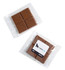 Chocolate squares wrapped in a clear cello bag, featuring a light brown colour with textured sections.