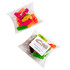 A pillow pack containing assorted jelly babies in vibrant colours, with a logo on the packaging.