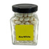 A small glass jar filled with white chewy mints, featuring a black lid and a label with branding.