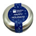 A round, silver candle tin featuring a blue label with festive designs and a holiday greeting.