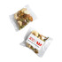 A clear sachet containing a mix of nuts and seeds, featuring cashews, almonds, and pumpkin seeds. It has a logo on the packaging.