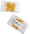 Eucalyptus lollies in a clear packet, featuring yellow lozenges and a logo on one side.