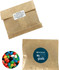 Kraft paper bag containing colourful jelly beans, featuring a circular logo on one side.