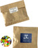 A kraft paper bag containing 50g of colourful JELLY BELLY jelly beans, featuring a logo on the front.