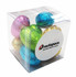 A clear cube containing mini Easter eggs in blue, pink, green, gold, and silver foil, with a logo on one side.