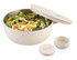 A salad bowl in cream colour with a lid, featuring fresh salad and a small container for dressing. It has a logo.