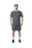 A grey Gildan Performance adult t-shirt displayed on a model, paired with dark sports shorts and shoes.