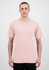 A plain pink short sleeve tee is displayed on a model against a neutral background. The shirt features a logo.