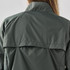 A dark green women's rain jacket featuring a high collar and back flap detail, with branding visible.