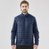 A men's softshell jacket in navy blue featuring a quilted front and zippered pockets. The jacket includes a logo.