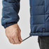 A navy puffer jacket featuring an adjustable hem and a logo on the side.