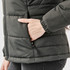 A women's dark green puffer jacket featuring a side pocket and quilted design. It has a fitted silhouette.