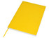 A yellow A5 notebook with a smooth cover, featuring a ribbon bookmark and a white spine.