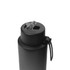A drink bottle in matte black stainless steel with a clear lid and silicone handle, featuring a logo.