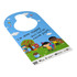 A door hanger featuring a colourful design with children playing outside, a tree, and a dog. It has a logo.