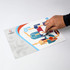 A magnetic jigsaw puzzle with colourful pieces being placed on a white background, featuring abstract designs.