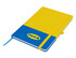 A blue and yellow A5 notebook with a logo and an elastic band closure. It features a ribbon bookmark.