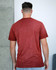 A red Colortone® Oil Wash T-Shirt is displayed from the back, featuring a simple design and short sleeves.