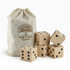A set of five wooden yard dice in a natural fabric bag, featuring black dots and a logo.