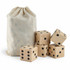 A set of wooden yard dice in a drawstring bag, featuring five light-coloured dice with black dots.