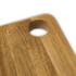 A wooden serving board with a natural acacia finish and a circular cut-out in one corner.