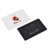 A flip card flash drive featuring a white side with a logo and a black side with different branding elements.