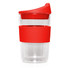 A double wall glass cup with a red lid and red silicone sleeve, designed for beverages.